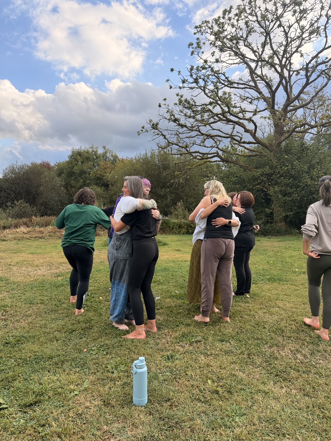 People connecting outdoors during a HELD gathering