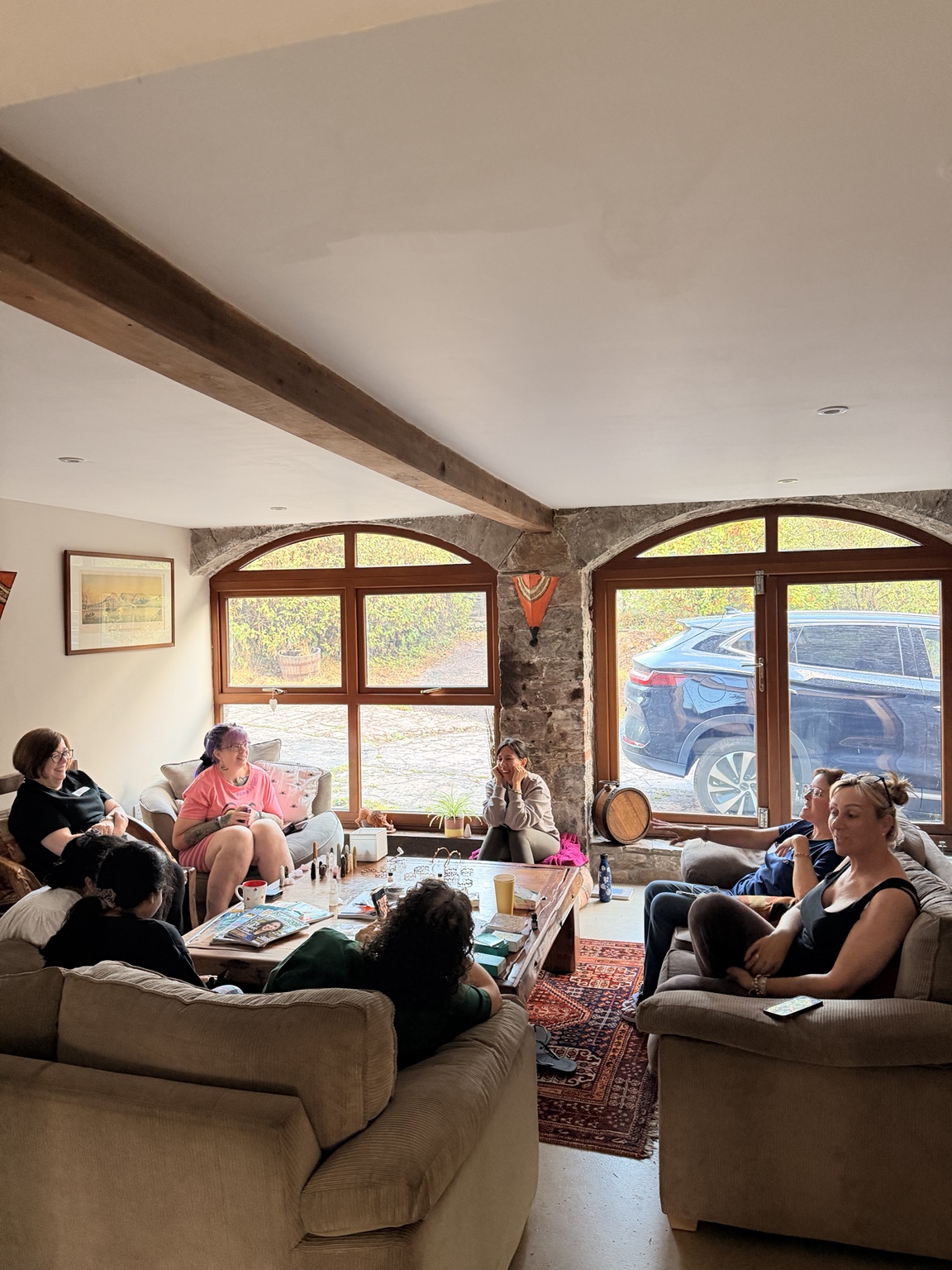 HELD retreat guests talking in a cosy room