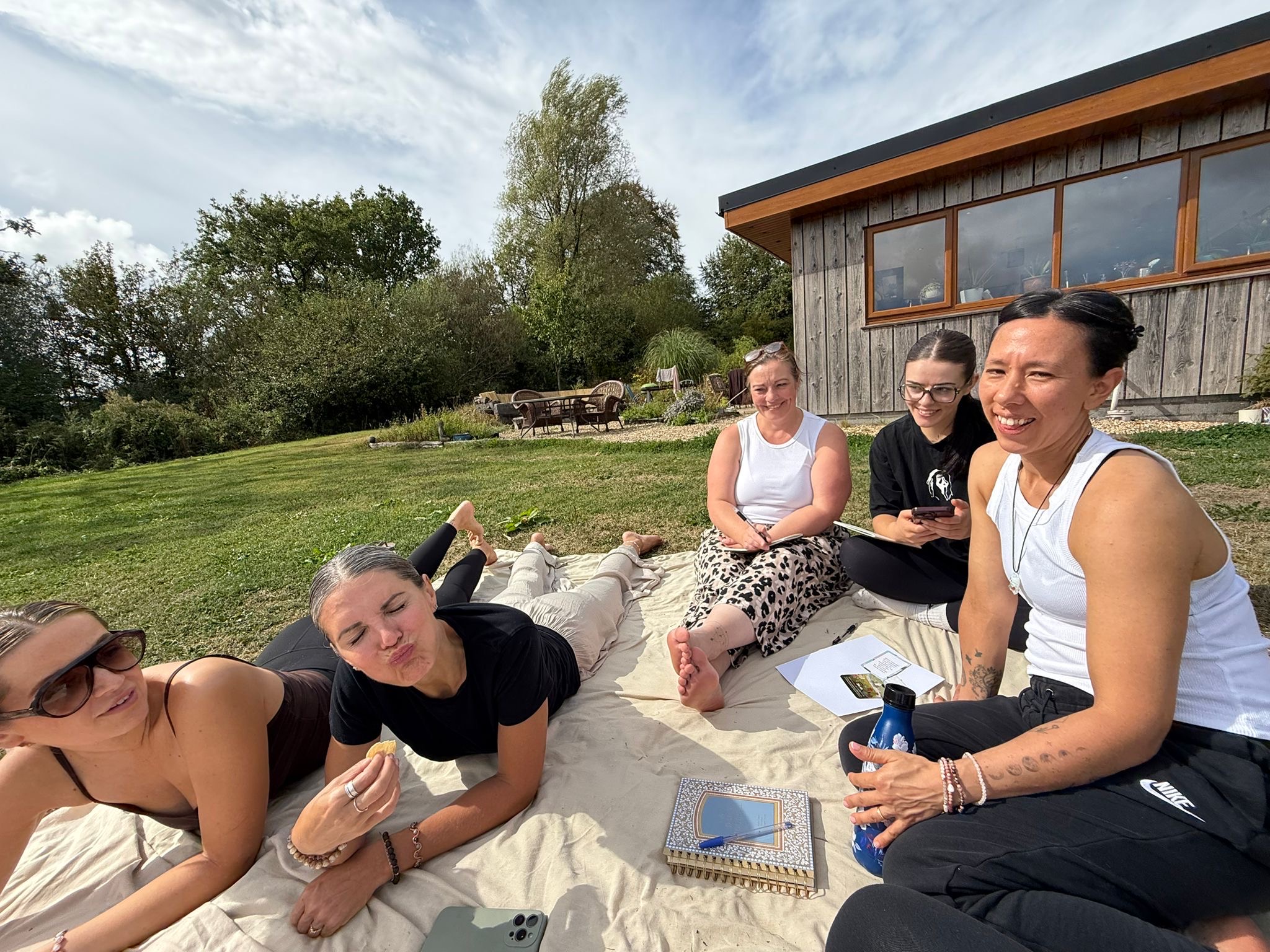 Retreat guests relaxing together outside